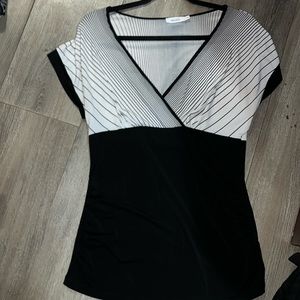 Ricki’s White and black strips blouse